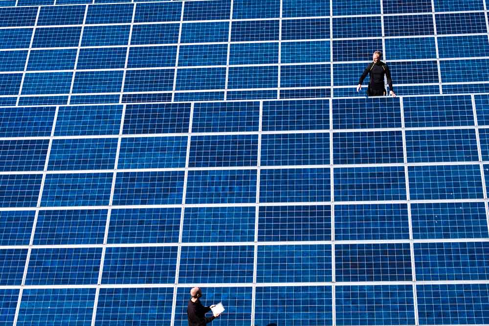 men-working-on-solar-panels-web.jpg